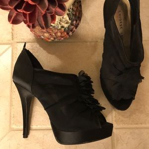 Black stilettos with ruffle detail